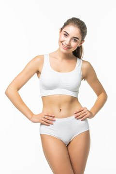 Attractive young woman in white underwear isolated on white background.