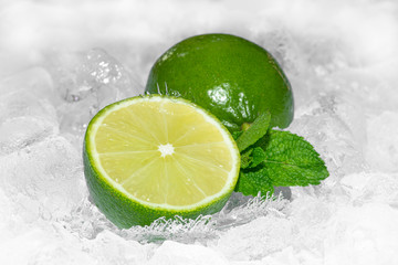 Staying healty. Healty lifestyle. Green Lemon and mint with crushed ice / ices cubes. Lemon ring. Ice background. Healty 2020. Healthy food. Health 2020