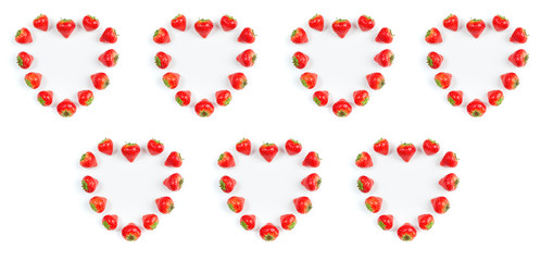 Strawberry on white background, top view. Valentines background. Hearts frame made of fresh strawberry on white. Berries pattern. Creative food concept