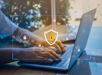 Person using a laptop computer with technology cybersecurity and privacy concept. protection and safe data for global network security.