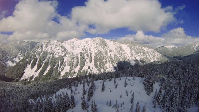 Aerial Reveal of Snow Covered Mountain Valley in Washington State