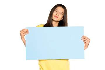 Naklejka premium young beautiful happy woman holding a blue empty board on white background