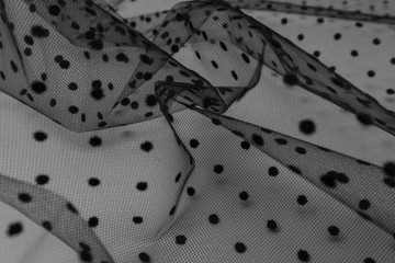 Beautiful close up of black tulle fabric with textile texture background