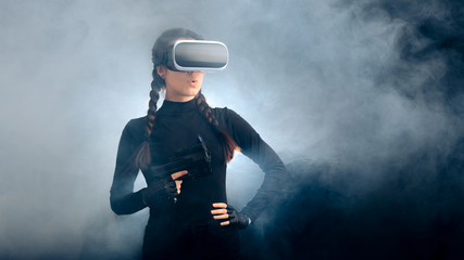 Woman Holding a Gun Wearing VR Glasses Headset