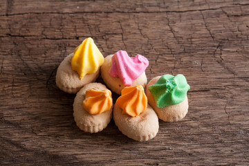 colorful cookies on wood background