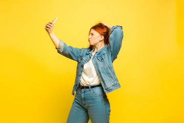 It's easier to be follower. Need minimum clothes for selfie. Caucasian woman's portrait on yellow...