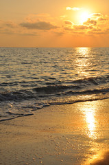 Sunset on the sea. Waves, foam, beauty