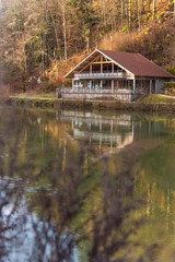 Fototapeta na wymiar wooden house by the river