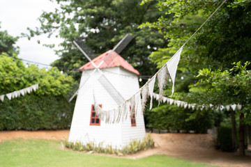 A small wooden house windmill