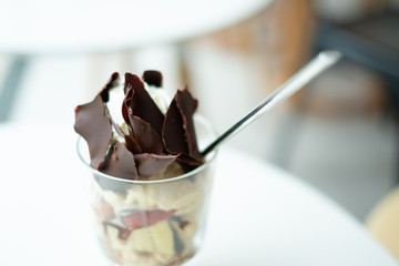 Grated chocolate with vanilla ice cream