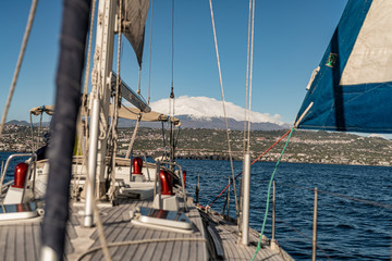 Sicily, Catania. View of the volcano Etna from a sailing boat