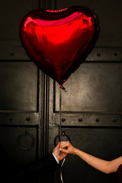 woman holding red heart