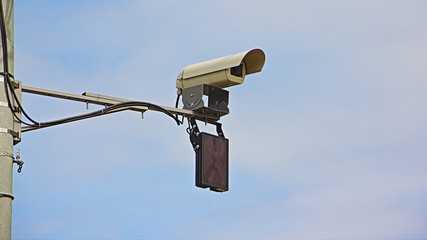 Road speed gun control camera close up view in Moscow on blue sky background