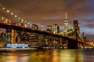 View of Manhattan skyline and Brookyn bridge from Brooklyn side after sunset , New york city