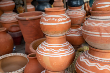 Fototapeta na wymiar Decorative terracotta clay pots for sale at a street market in New Delhi India