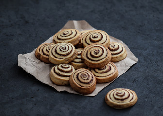 Cookies twisted with cinnamon and milk festive on a dark background, Christmas and New Year