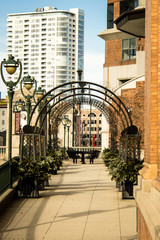 An iron arch frames a picnic spot on the Milwaukee River Walker