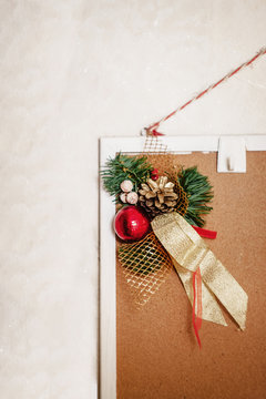 Christmas decor decoration from fir branches, balls and ribbons hanging on a home mudboard on a white background.