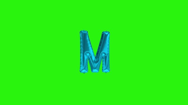 Blue letter M. Blue foil helium balloon alphabet floating on green screen
