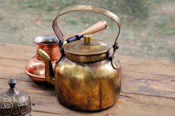 Antique brass teapot and copper coffee maker