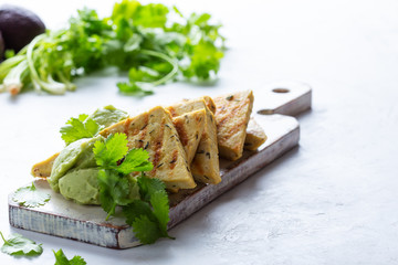 Grilled herbed tofu with avocado cream,  vegan meal, plant based diet
