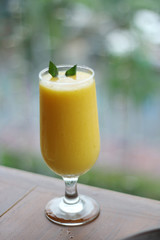 Fresh Juice mango in blurred background. Ice mango