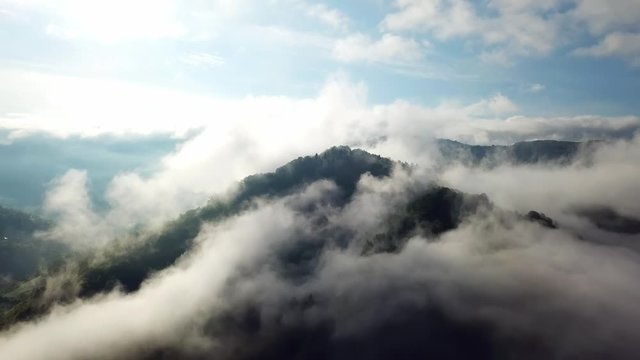 morning clouds in the mountains aerial, aerial view of morning fog in mountains, Aerial view above the clouds and sky in sunrise time, Majestic clouds in the mountains landscape in Carpathian