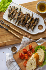 fresh tasty fish with vegetables on a cutting board
