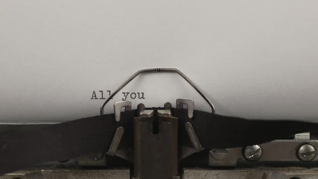 typing a quote all you need to know, old vintage typewriter with a sheet of paper