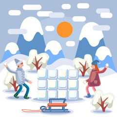 Winter, winter landscape, snow around boy and girl built an ice wall and play snowballs. There are sledges next to the ice wall. Bushes grow around. In the background mountains.