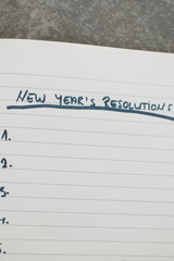 list of new year's resolutions in a notebook