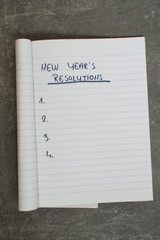 list of new year's resolutions in a notebook