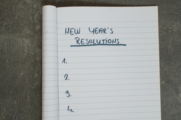 list of new year's resolutions in a notebook