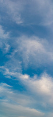 Fantastic clouds against blue sky, panorama