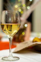 two glasses of white wine on a table
