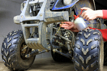 Carring Out Maintenance Repairs On A Quad Bike