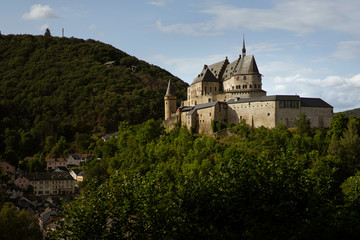 Fototapeta na wymiar Panoramic view of the medieval castle of Vianden, Luxembourg, on a hill in the forest
