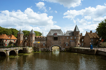 Fototapeta premium Dutch city during summer, Medieval town wall Koppelpoort and the Eem river in Amersfoort, Netherlands