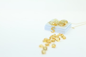 precious gift for your lover. Yellow sapphire gemstone jewellery and yellow loose stone on white background. Gems and Jewellery background       