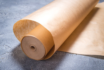 Roll of baking paper on dark background