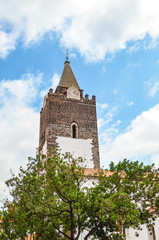 Fototapeta na wymiar Tower of the Cathedral of Our Lady of the Assumption in Funchal, Madeira, Portugal. The Roman Catholic church is a major tourist attraction of the Madeiran capital. Portuguese tourist destination