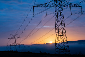 high voltage post,High voltage tower sky surise background