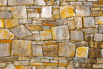 Old stone brick wall pattern texture background. Old wall of ancient architecture. Background of...