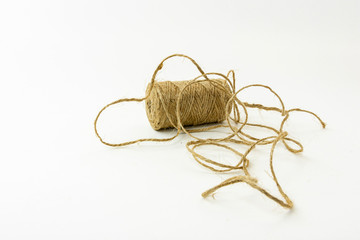 Spool of jute twine isolated on white background.