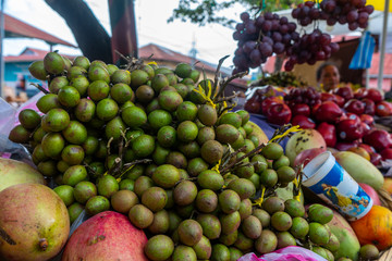 Tropical fruits known as mamoncillo, anoncillo, mojón, huaya, maco, cojoncillo, chupalotes, guaretones, mamalón, chupones, güevillos or limoncillo in latin america. Fruits selling in Nicaragua.