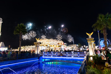 People enjoying fireworks in Duabai Global village the most visited tourist attractions in the United Arab Emirates - obrazy, fototapety, plakaty