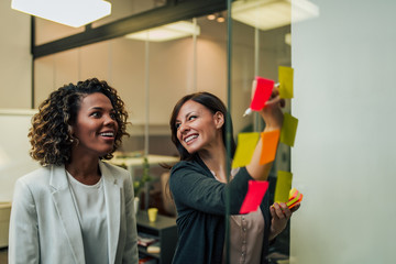 Laughing entrepreneurs people working on new project.