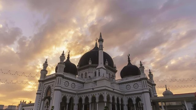 timelapse of a mosque at sunset