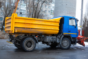 Big snow truck with red bucket a