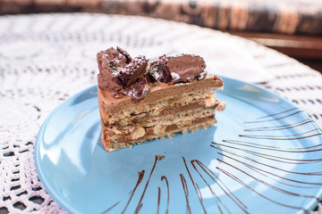 Kiev cake on a table in a cozy chocolate bar. Tasty and not healthy food.